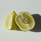 Halved lemon on a light gray background