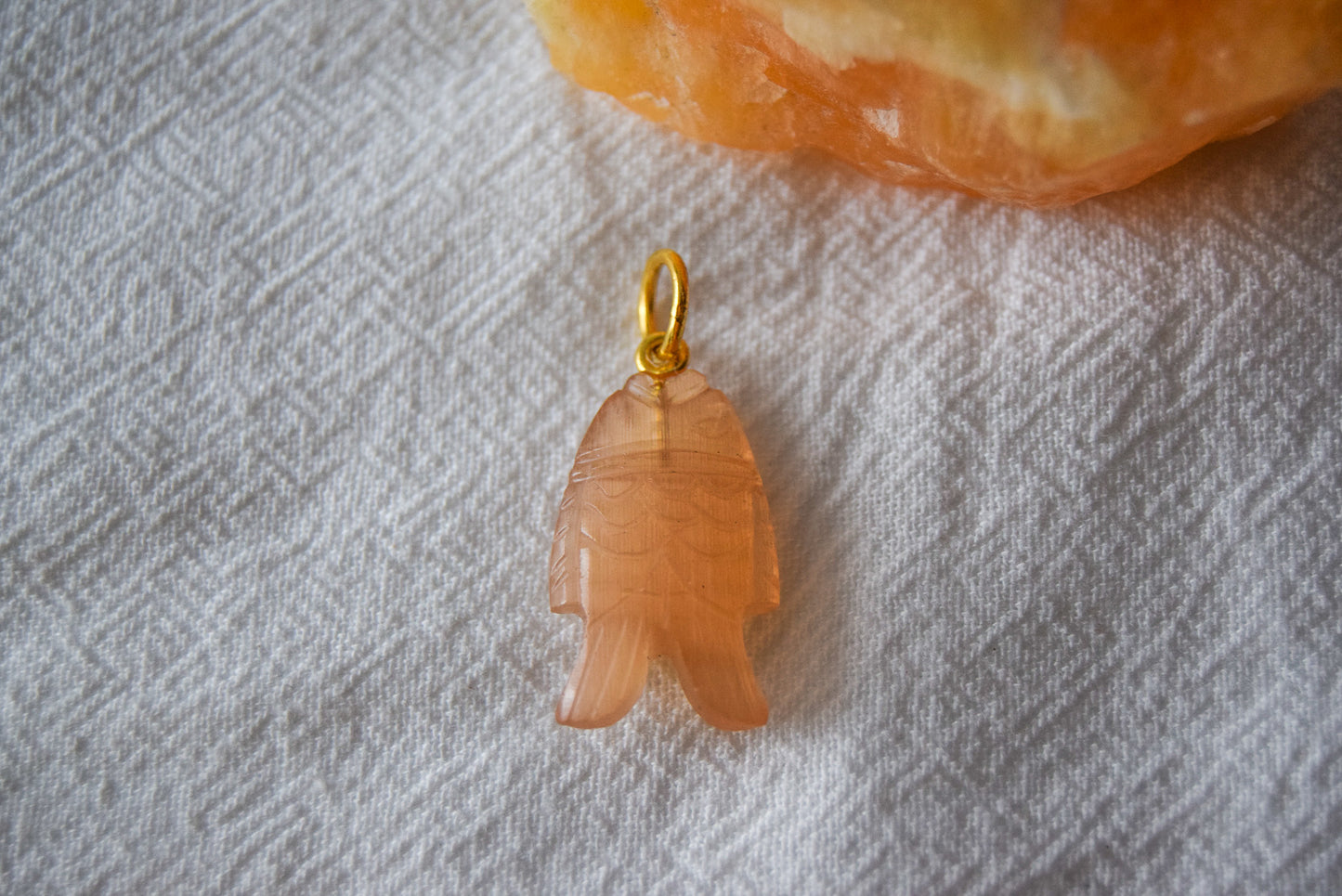 Intricately detailed, this versatile rutilated quartz leaf features a delicate leaf design carved from rose quartz gemstone, it is perfect for various jewelry creations like a necklace or earrings.