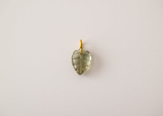 Intricately detailed, this versatile rutilated quartz leaf features a delicate leaf design carved from rose quartz gemstone, it is perfect for various jewelry creations like a necklace or earrings.