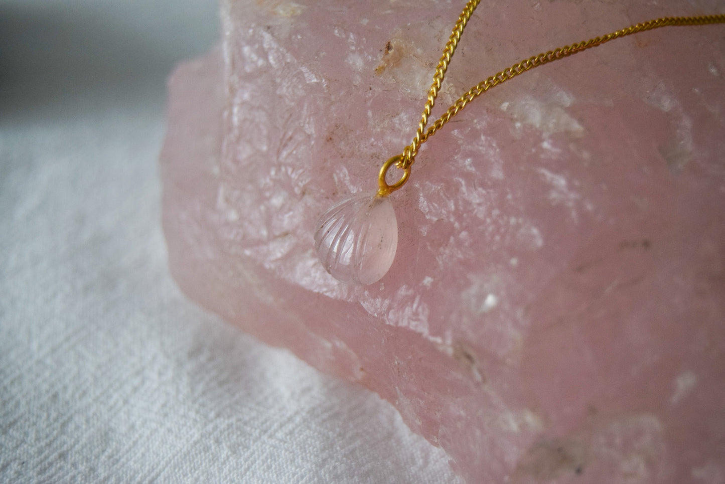 Intricately detailed, this versatile rutilated quartz leaf features a delicate leaf design carved from rose quartz gemstone, it is perfect for various jewelry creations like a necklace or earrings.